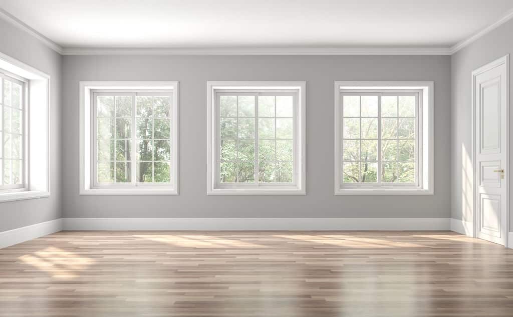 Sunlit interior of a grey walled room | featured image for Paint Colours That Will Increase Your Home Value Forever.