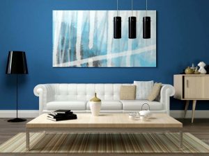 Modern living room with dark blue wall and white couch | featured image for Painting and Decorating Brisbane & Gold Coast.