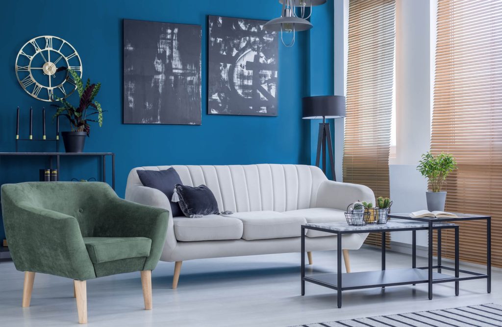 Living room interior with blue tones | Featured image for the Hamilton location page for Diamond Brothers.